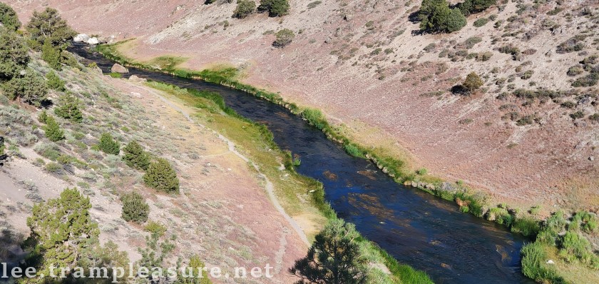 photo showing a stream through a valley