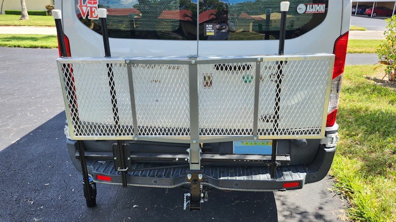 Photo showing rack tilted up against back of van